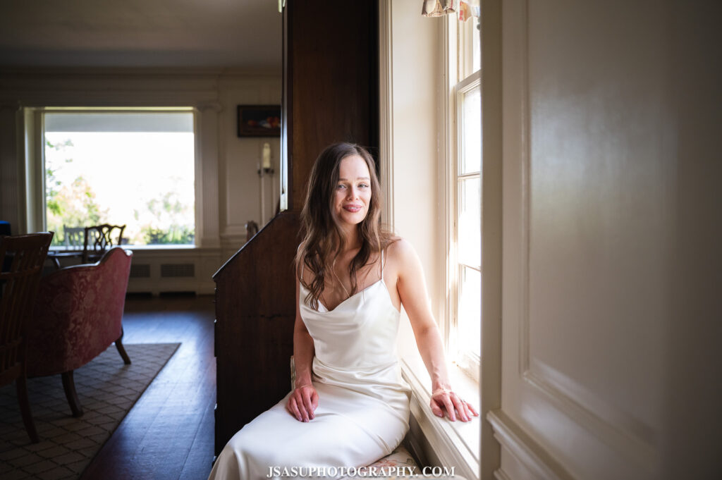 Bride getting dressed at River Farm Mansion