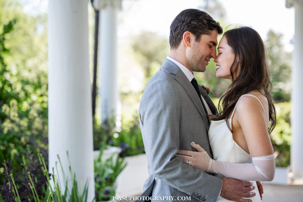 bride and groom outside posing for photo at River Farm Mansion