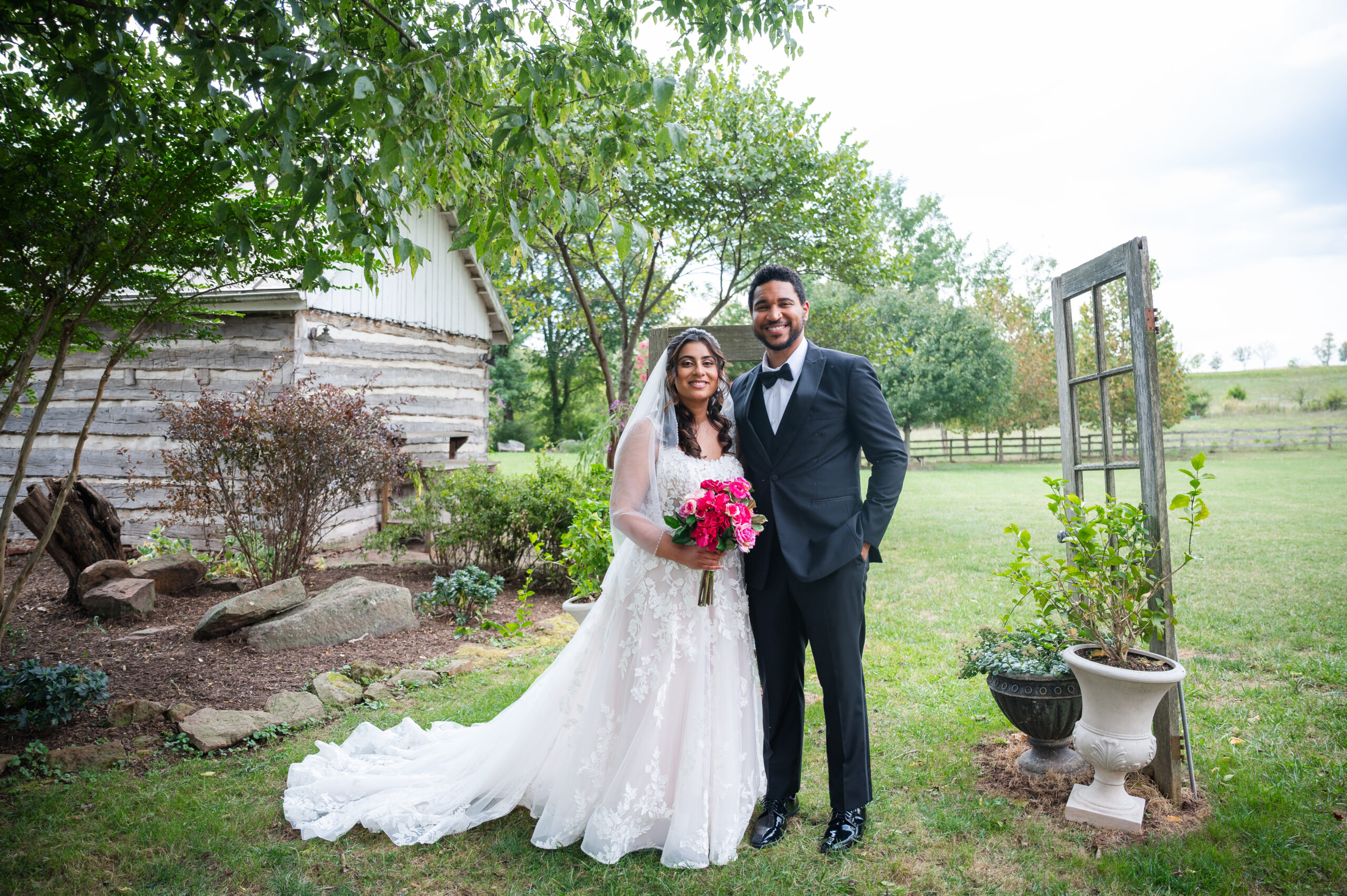 wedding couple posing for portraits in lawn at rocklands farm