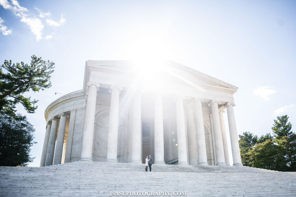 sunrise behind the thomas jefferson memorial during an engagement session