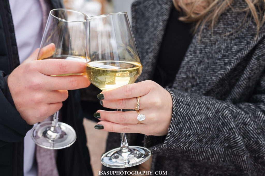 two wine glasses and an engagement ring at old westminster winery