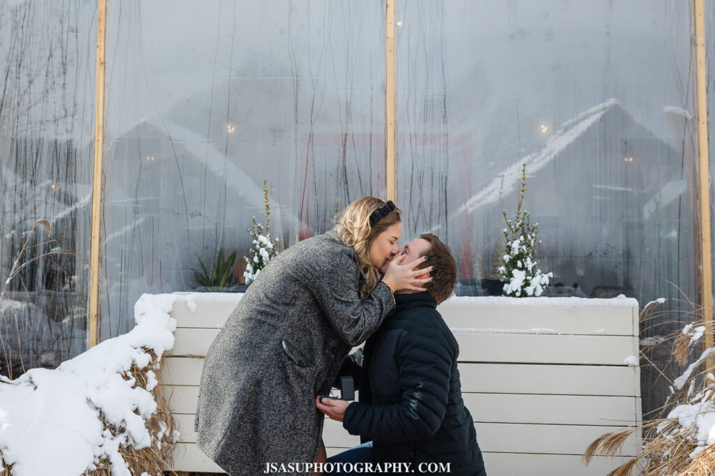 a couple kissing during their engagement at old westminster winery