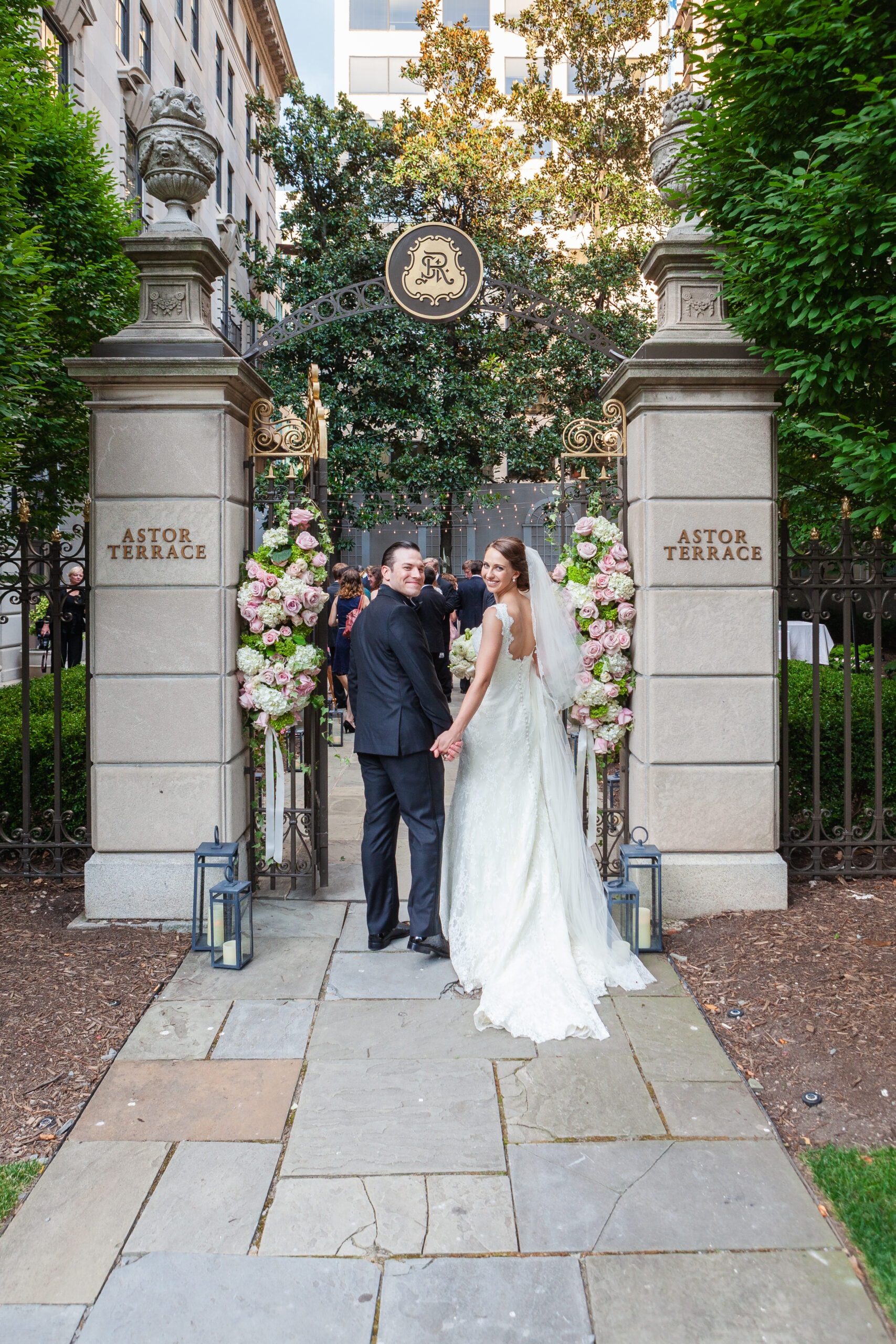 couple posing for photo outside of aster terrace at the st. regis in washington, dc