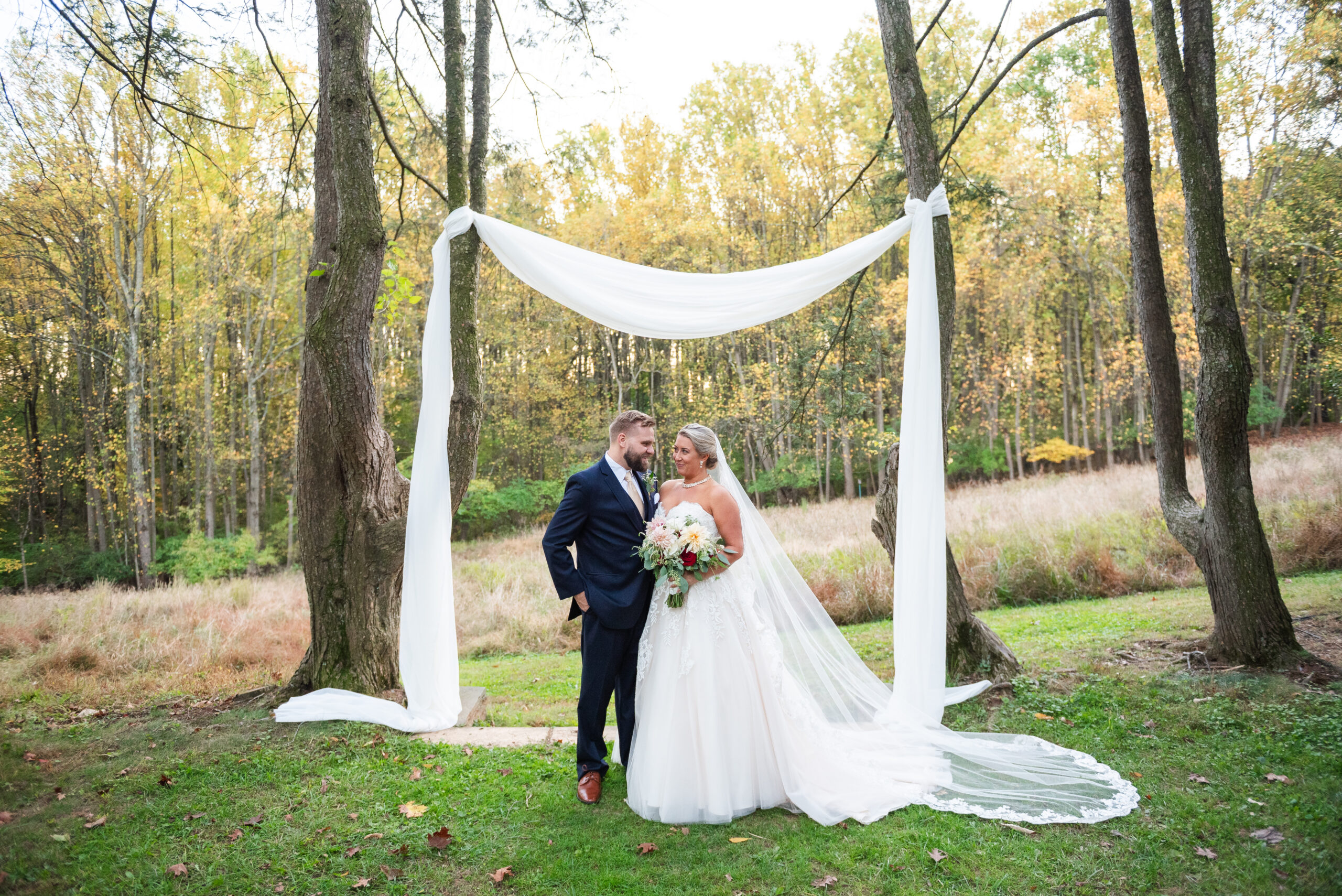 couple posing after wedding ceremony at woodend sanctuary in chevy chase md