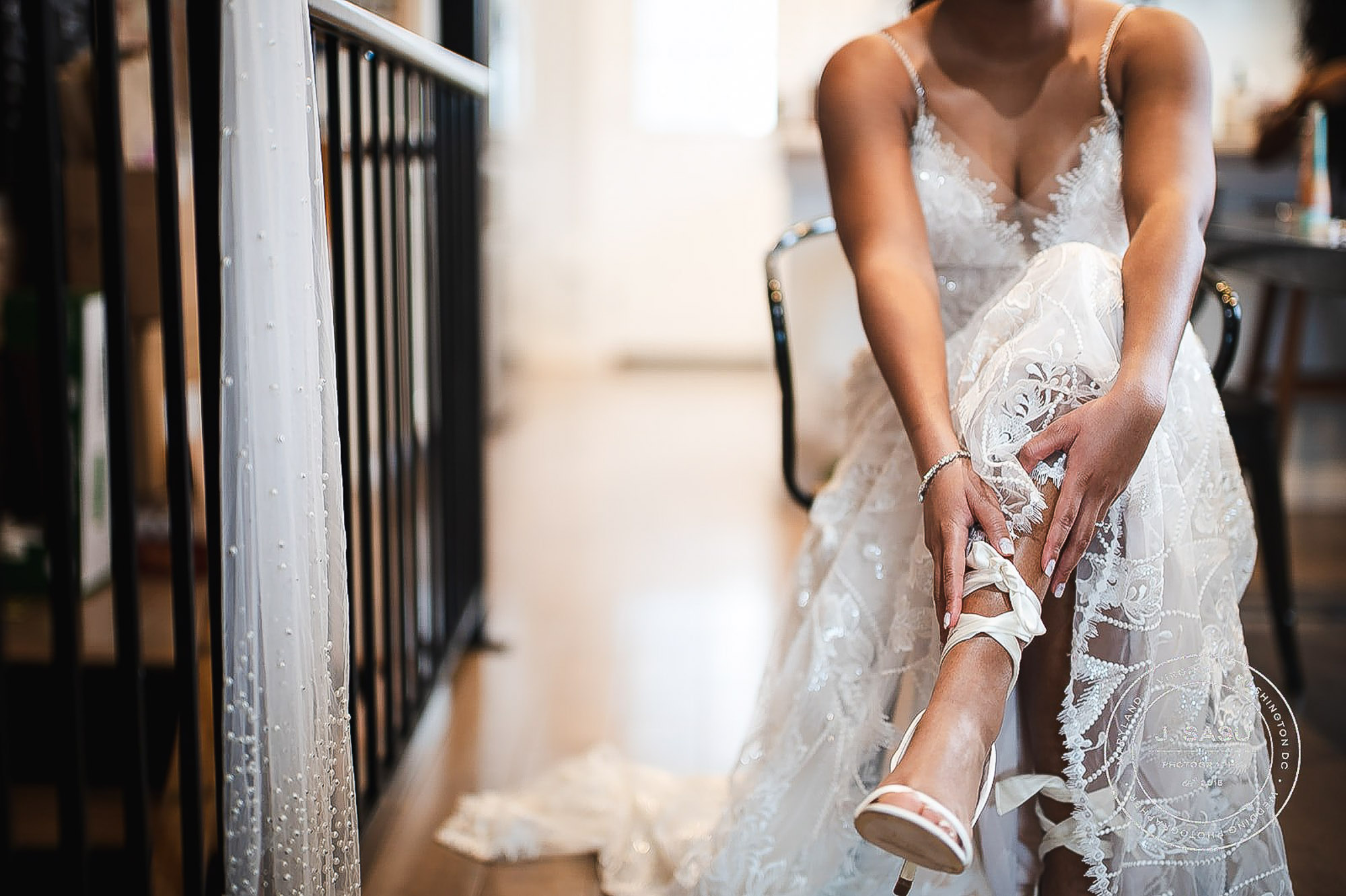 bride putting on her wedding shoes 