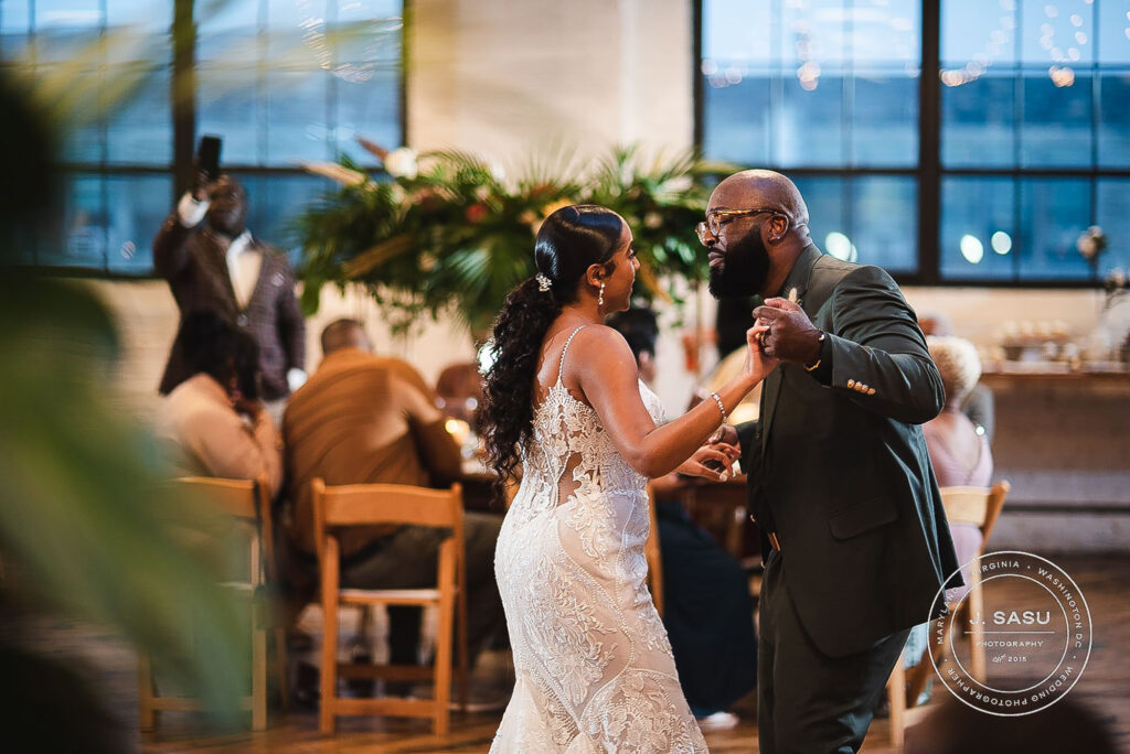 bride and groom share a dance