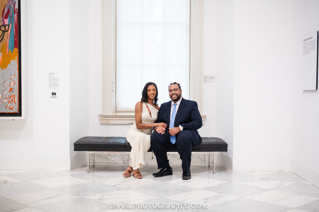couple posing for photo near window at the National Portrait Gallery in Washington, DC
