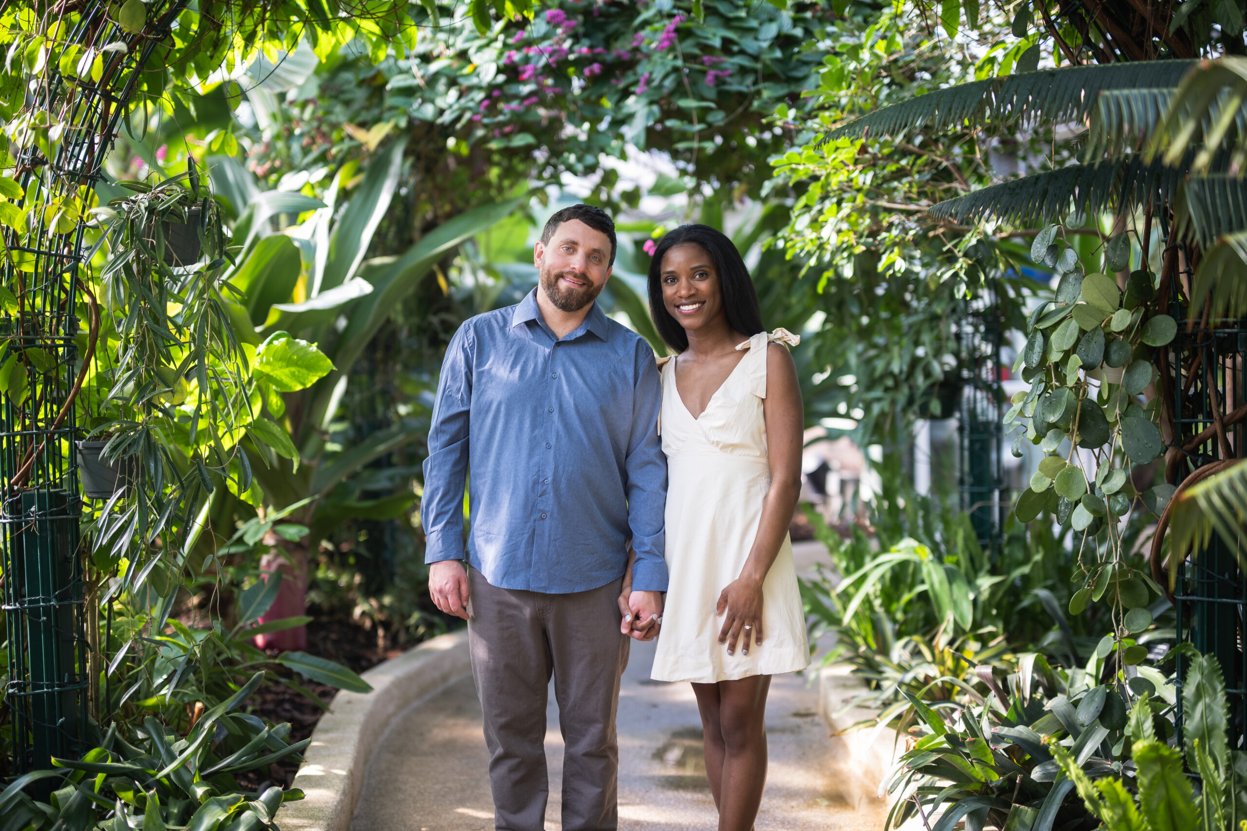 couple posing for engagement photo at rawlings conservatory in baltimore, md
