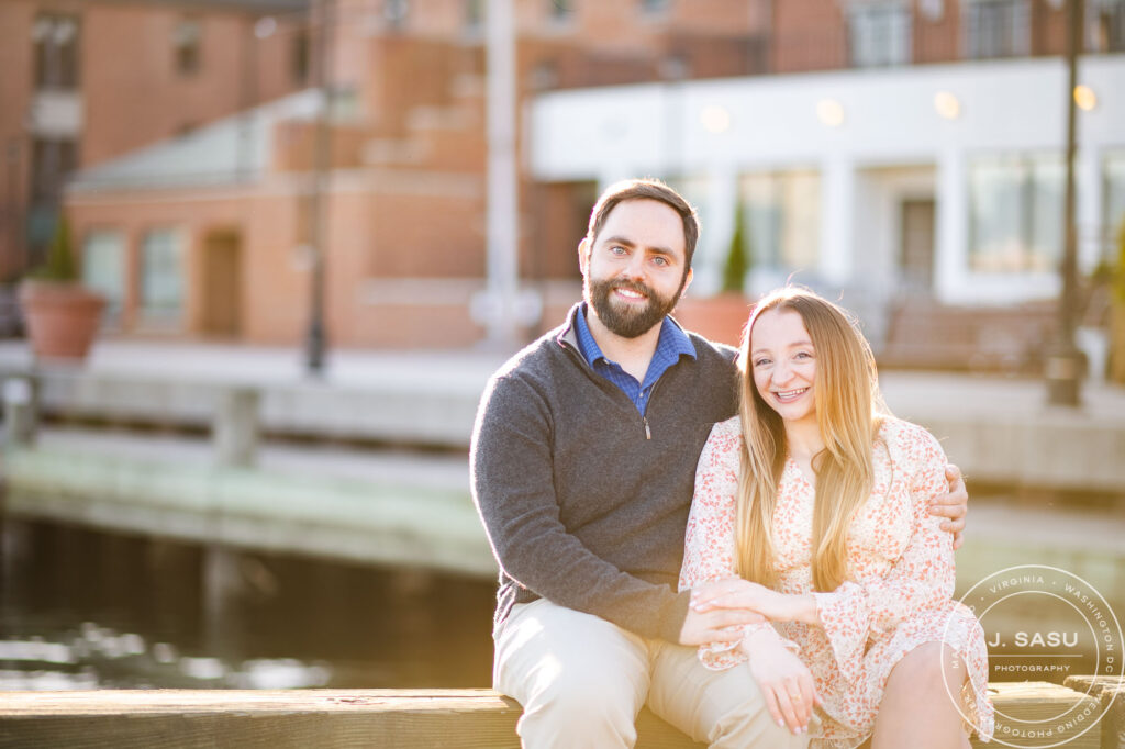 Couple walking along Baltimore Inner Harbor waterfront