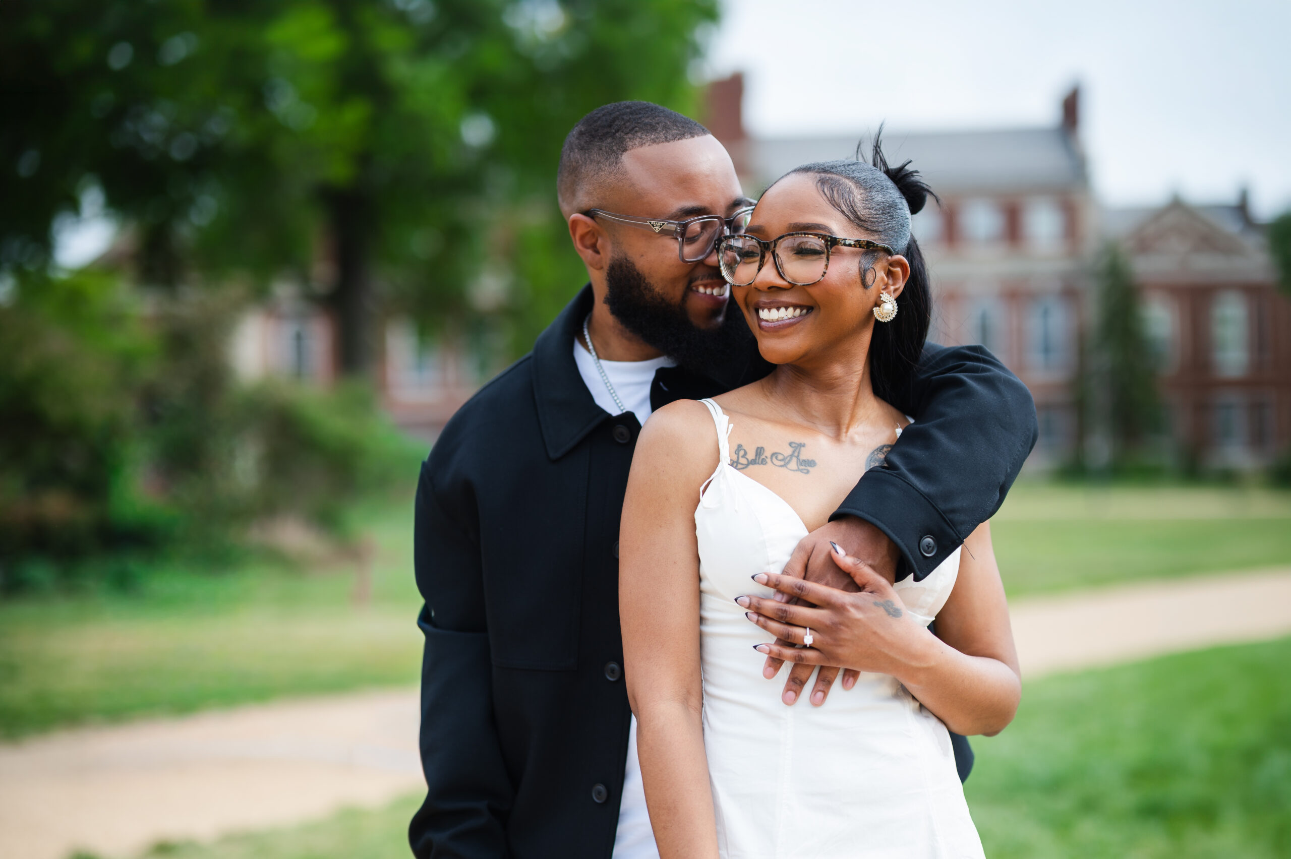 A couple poses for photos on Howard University's campus
