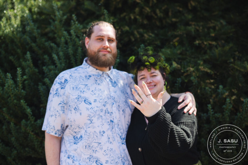A couple poses for photos at their engaement session at the Smithsonian Castle in Washington, DC 