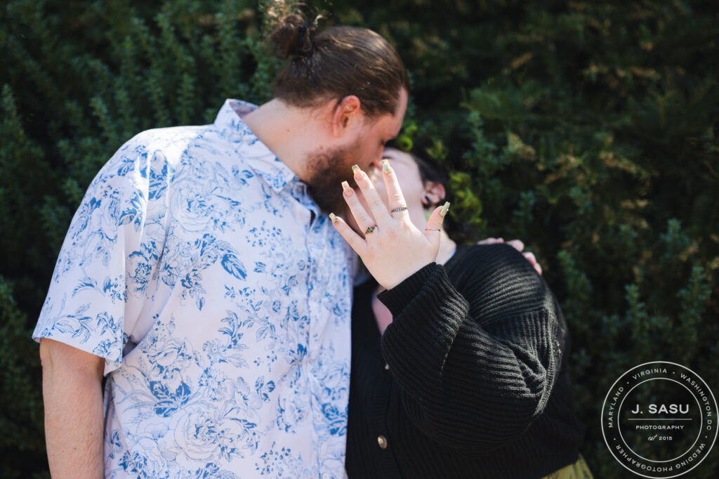 A woman shows off her engagement ring after a surprise proposal at the Enid A. Haupt garden in Washington, DC. 